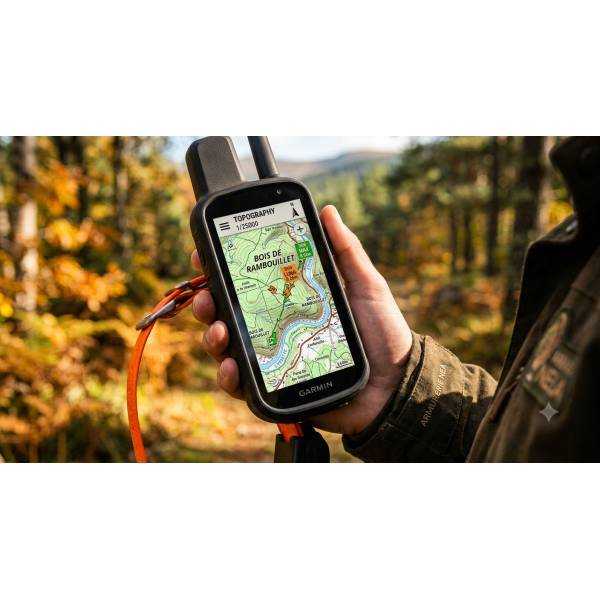 Chasseur tenant une centrale Garmin Alpha 300 affichant une carte détaillée topographique